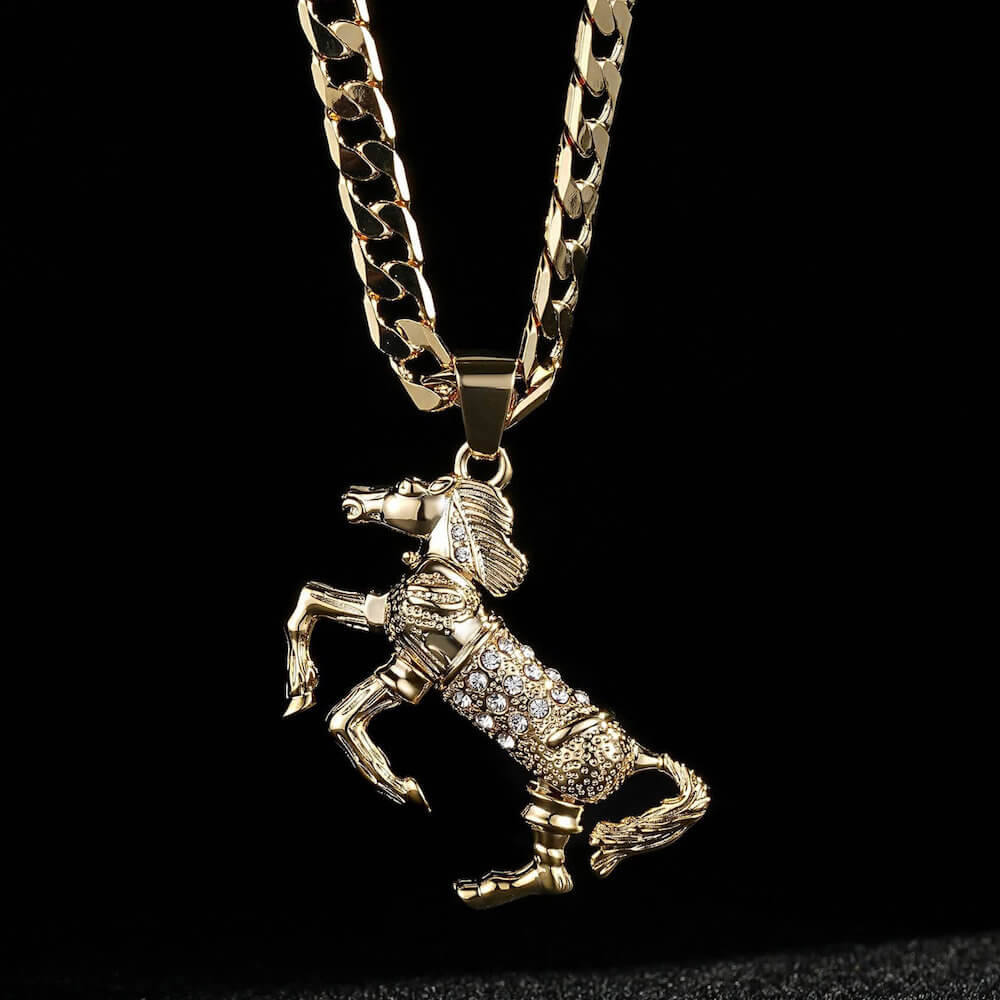 Detailed close-up of the gold horse pendant with pink stones, measuring 45mm x 30mm