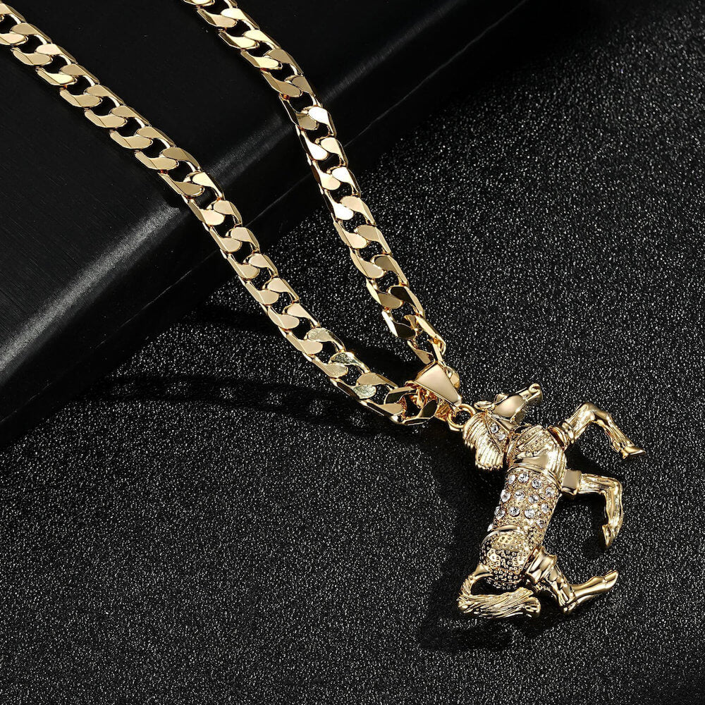 Complete view of the gold-filled pendant and chain set, highlighting pink stones and horse