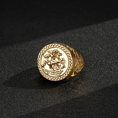 Gold sovereign ring with a 25mm top view on a reflective surface