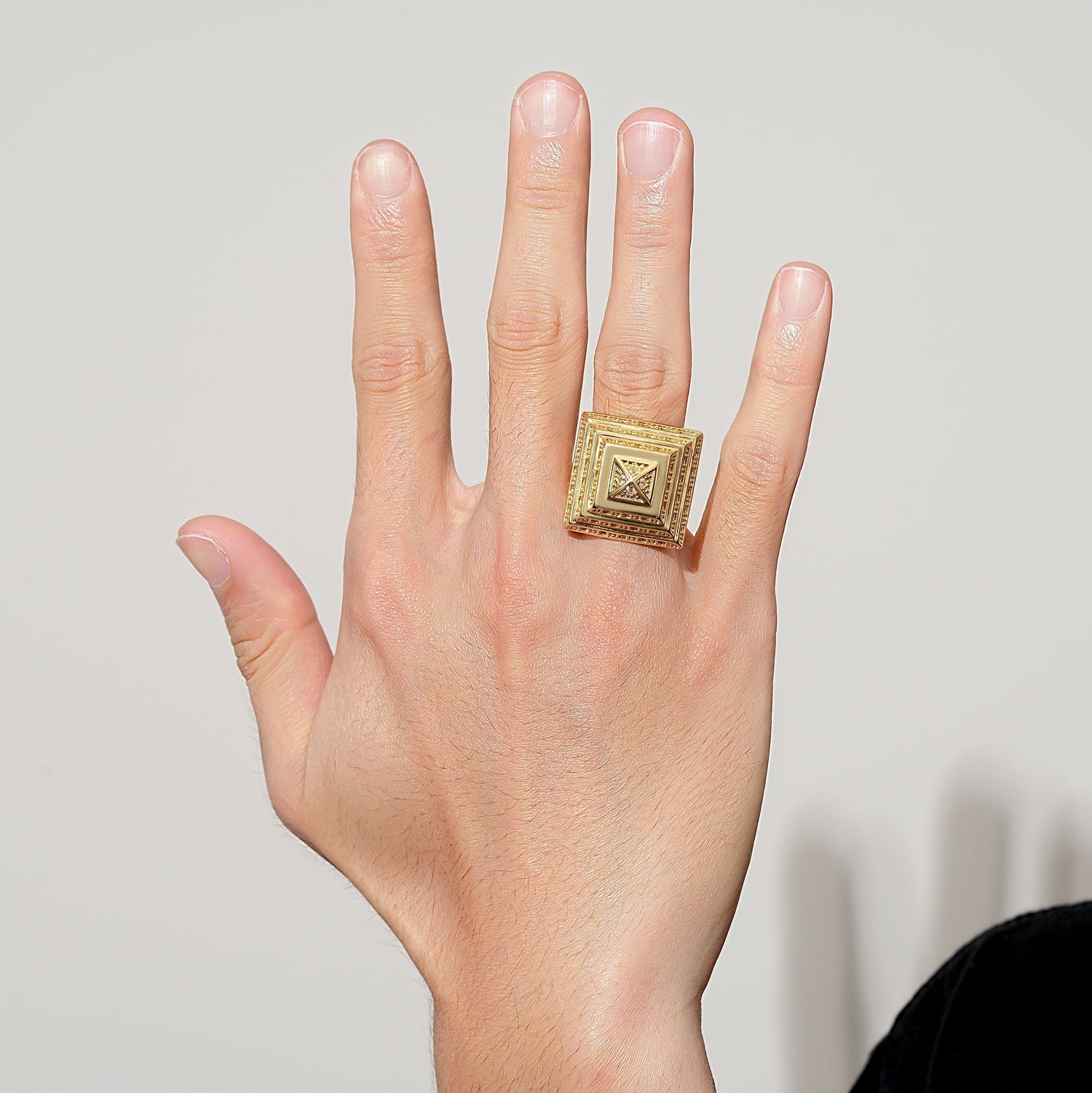 Shiny gold bonded ring featuring pyramid shape