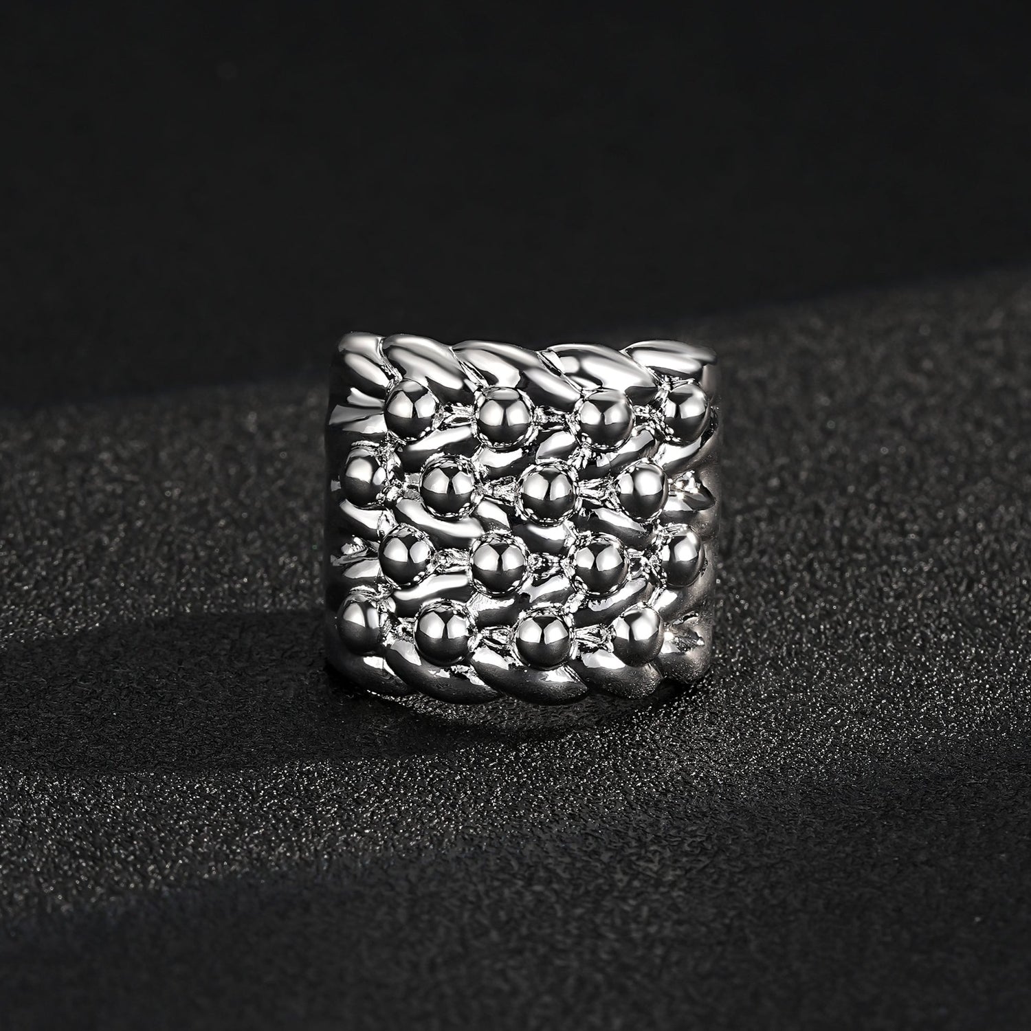 Close-up of a shiny silver keeper ring with a 23mm square top