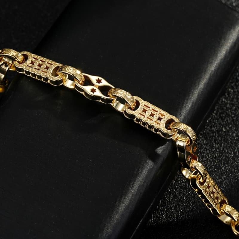 8/8.5-inch gold stars and bars bracelet, 7mm wide, 7 grams, classic design, gold finish.