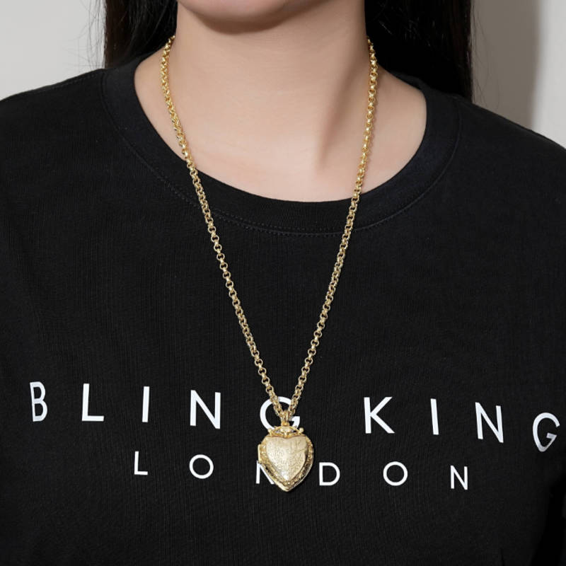 Close-up of Gold Filled Heart Locket Pendant with Bird and Flowers