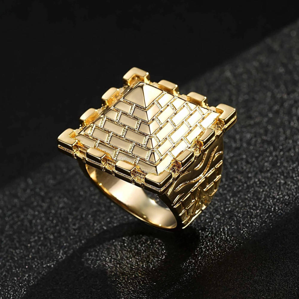 Castle-style gold pyramid ring, size 12, 50 grams