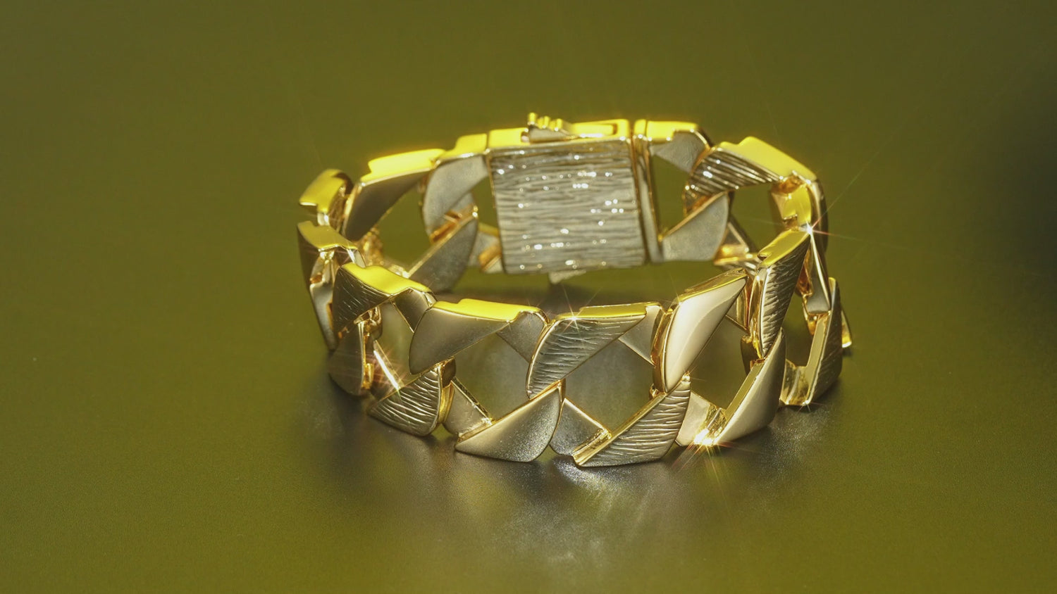 Big gold Cuban bracelet, 27mm wide, 9 inches, 120 grams, gold-filled, bark pattern.