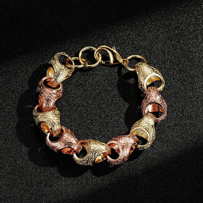 2-tone gold and rose gold acorn bracelet, 17mm wide, 8/8.5 inches, 80 grams.