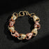 2-tone gold and rose gold acorn bracelet, 17mm wide, 8/8.5 inches, 80 grams.