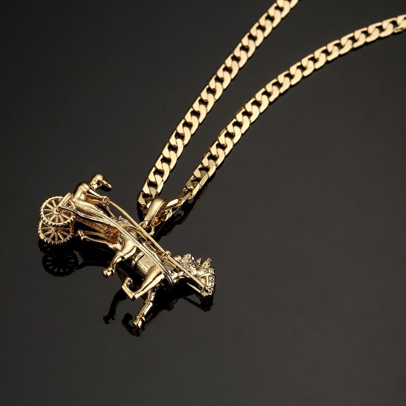 Close-up of gold horse and cart pendant showing intricate details