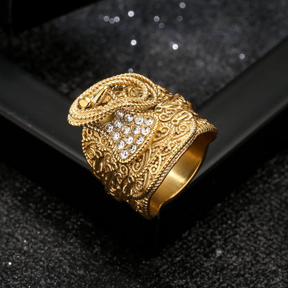 Gold saddle ring with a 22mm top on a reflective surface